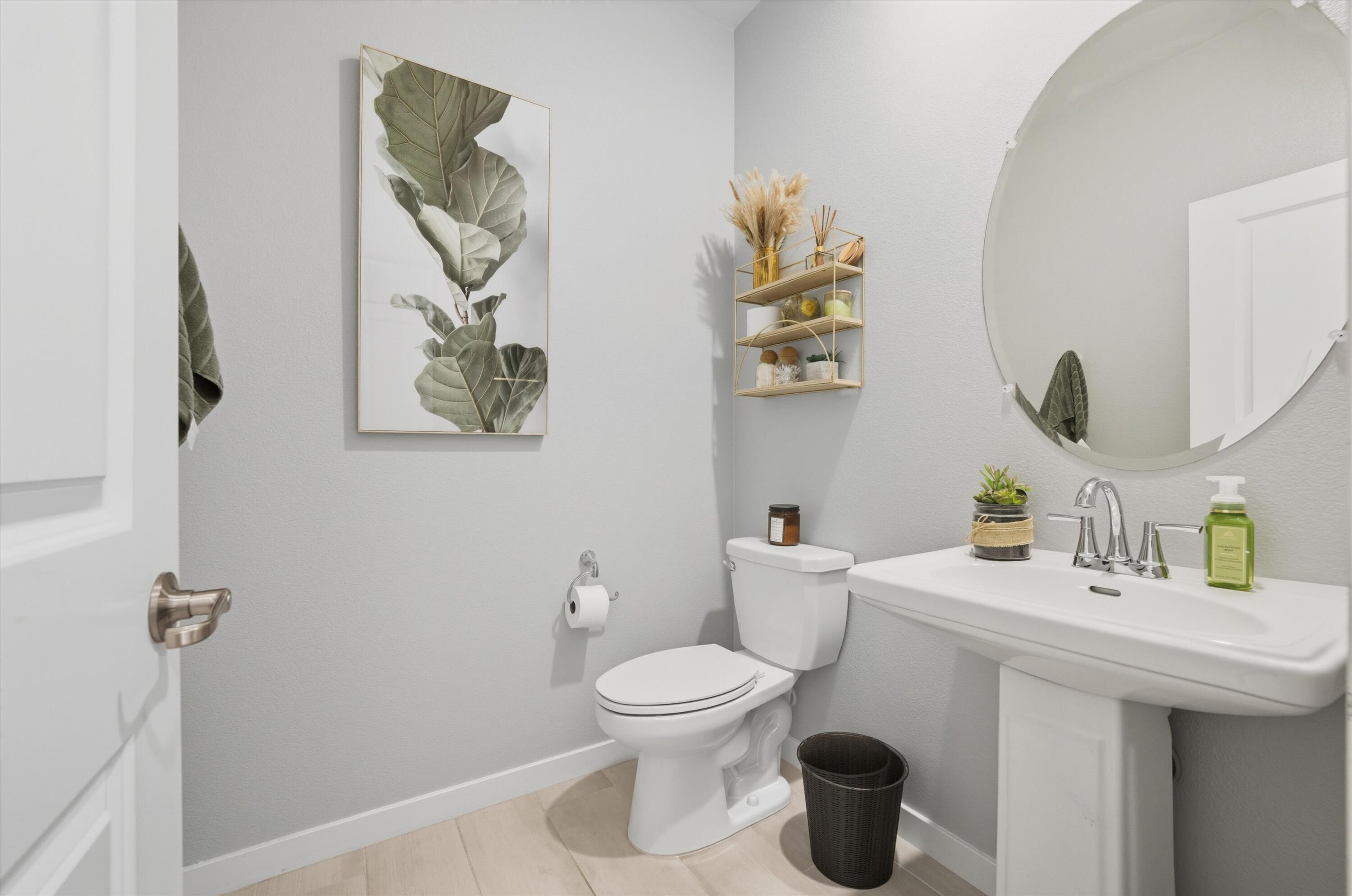 40340 Vivaldi Court Indio, CA 92203 - Photo 16 of 30 a bathroom with a sink a toilet and a mirror