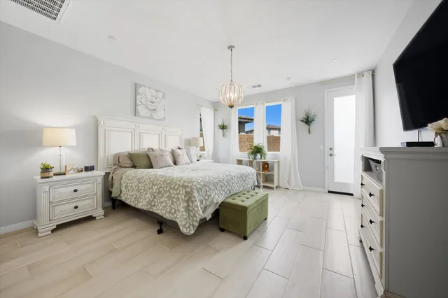 a spacious bathroom with double sink and a mirror