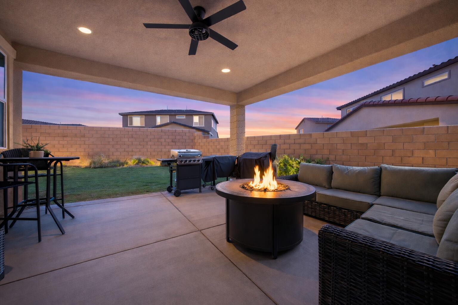 40340 Vivaldi Court Indio, CA 92203 - Photo 5 of 30 a outdoor living space with furniture and a fireplace