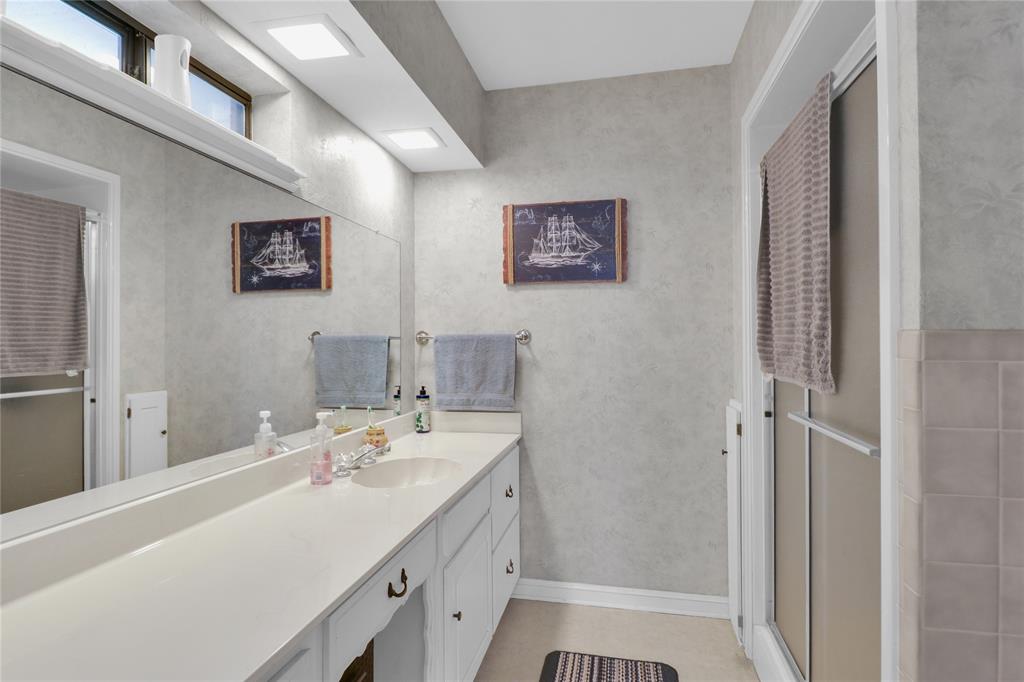 16223 Big Oak Bay Road Tyler, TX 75707 - Photo 28 of 30 Full bath featuring vanity, a stall shower, and light tile patterned floors