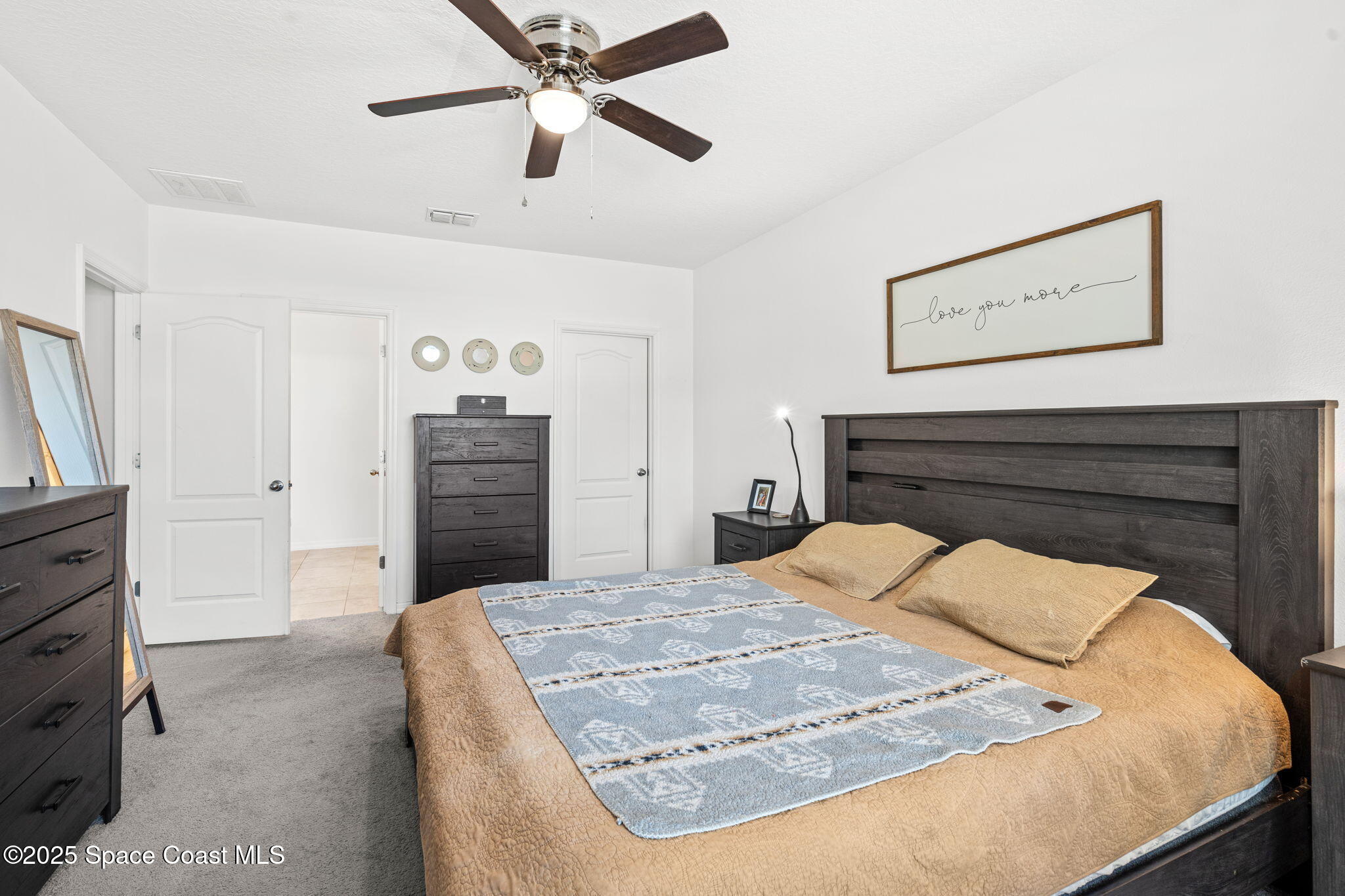 6162 Rena Avenue Cocoa, FL 32927 - Photo 15 of 42 a bedroom with a bed and a dresser