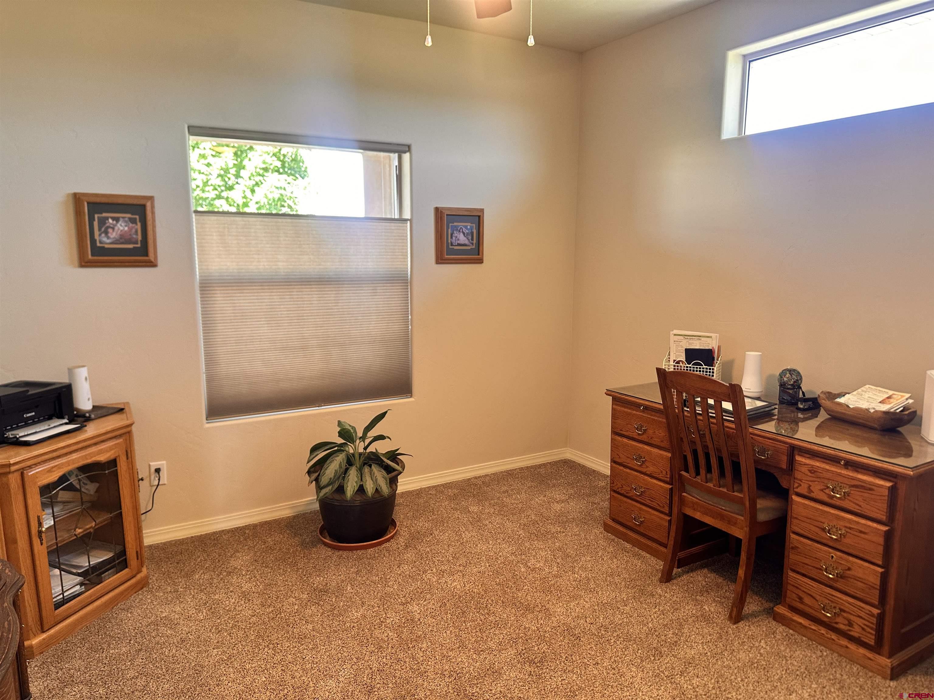 1889 Snaffle Bit Road Delta, CO 81416 - Photo 20 of 45 a room with furniture and a window