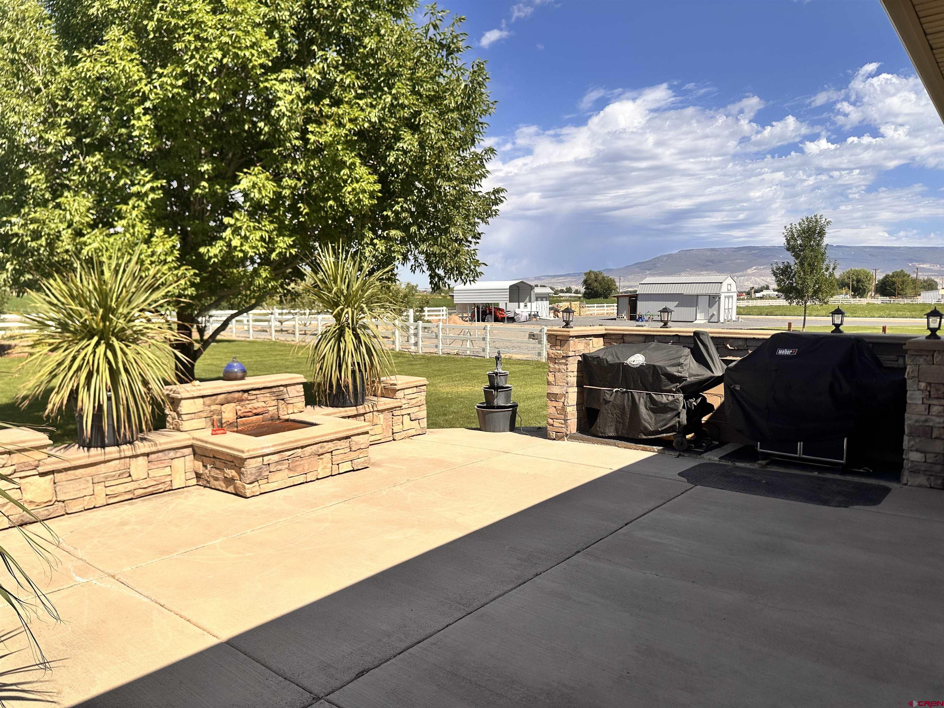 1889 Snaffle Bit Road Delta, CO 81416 - Photo 33 of 45 a view of a patio with swimming pool and furniture