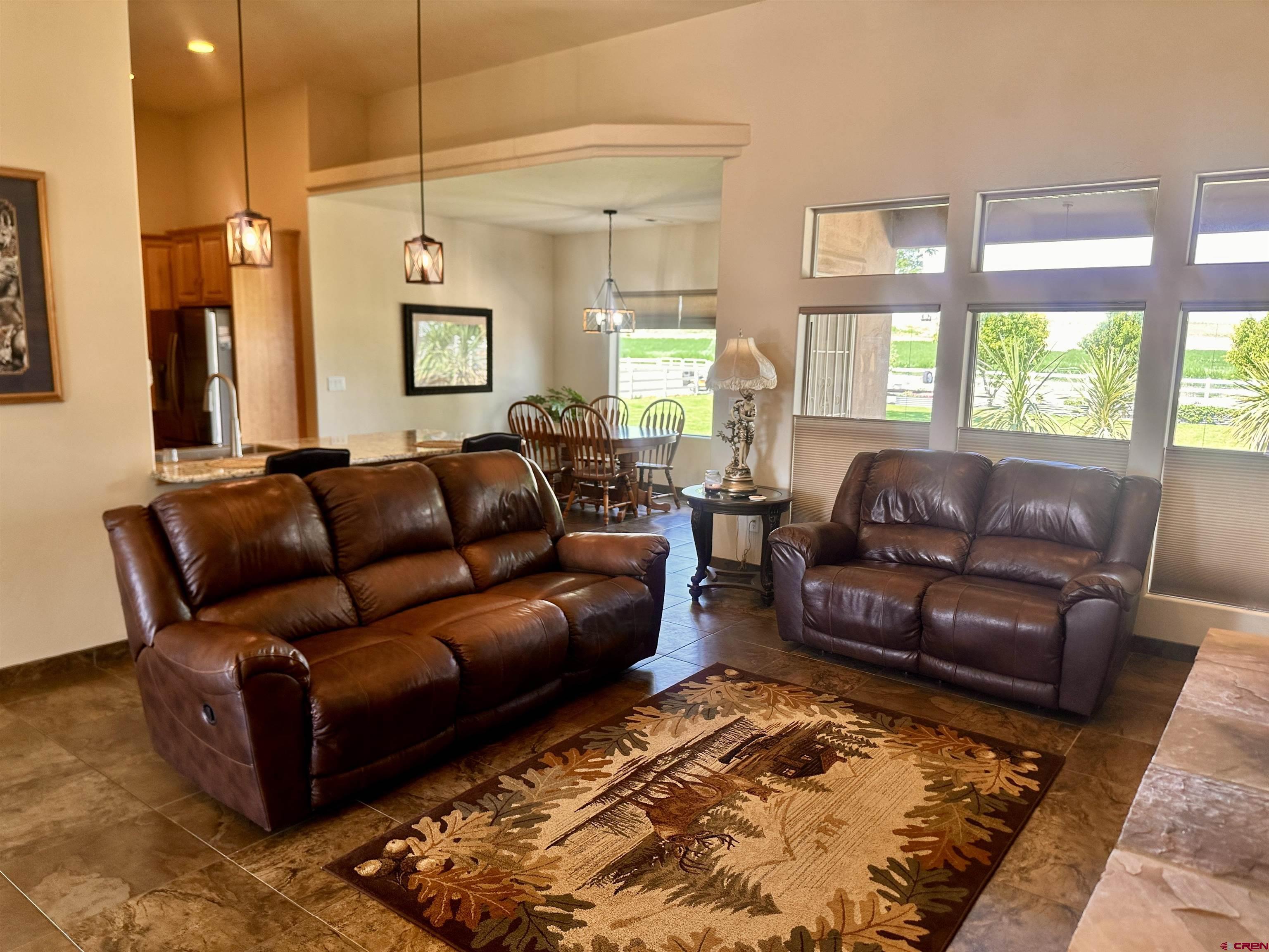 1889 Snaffle Bit Road Delta, CO 81416 - Photo 5 of 45 a living room with furniture rug and a large window