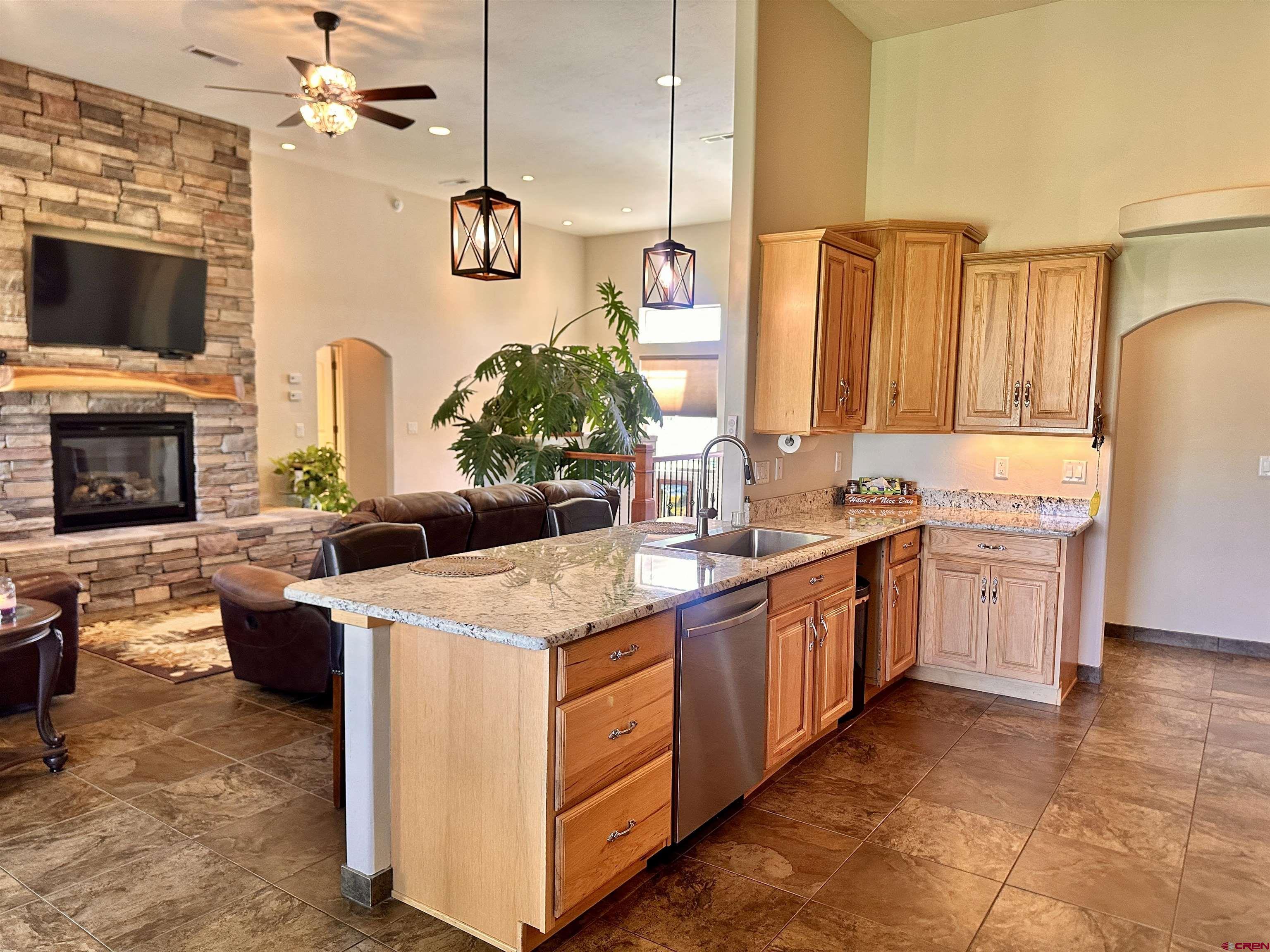 1889 Snaffle Bit Road Delta, CO 81416 - Photo 9 of 45 a kitchen with a stove a sink and a refrigerator