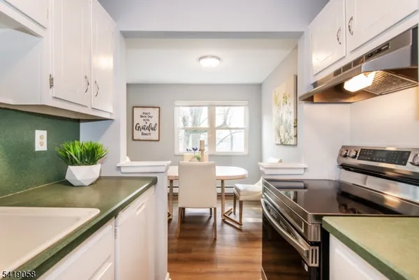 a kitchen with a table and chairs