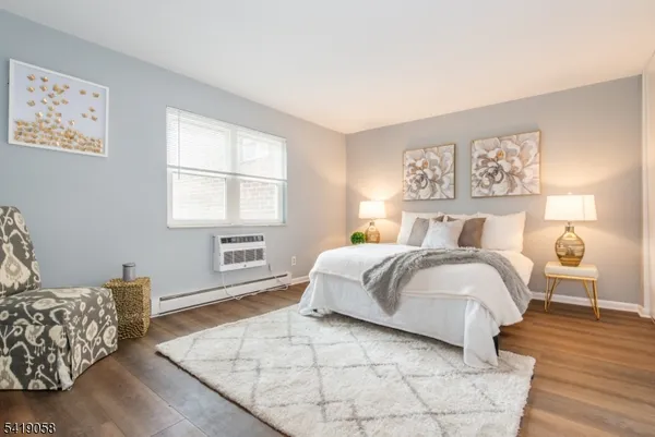 a bedroom with a bed and a couch