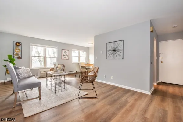 a view of a livingroom with furniture and wooden floor