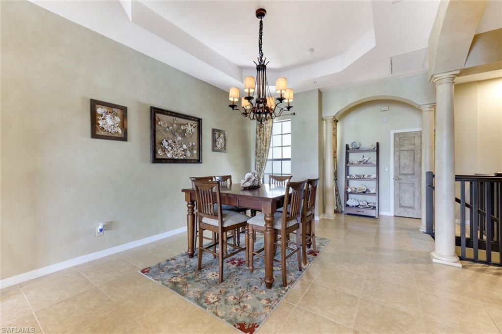 3530 Lansing Loop, Unit 202 Estero, FL 33928 - Photo 17 of 35 a view of a dining room with furniture