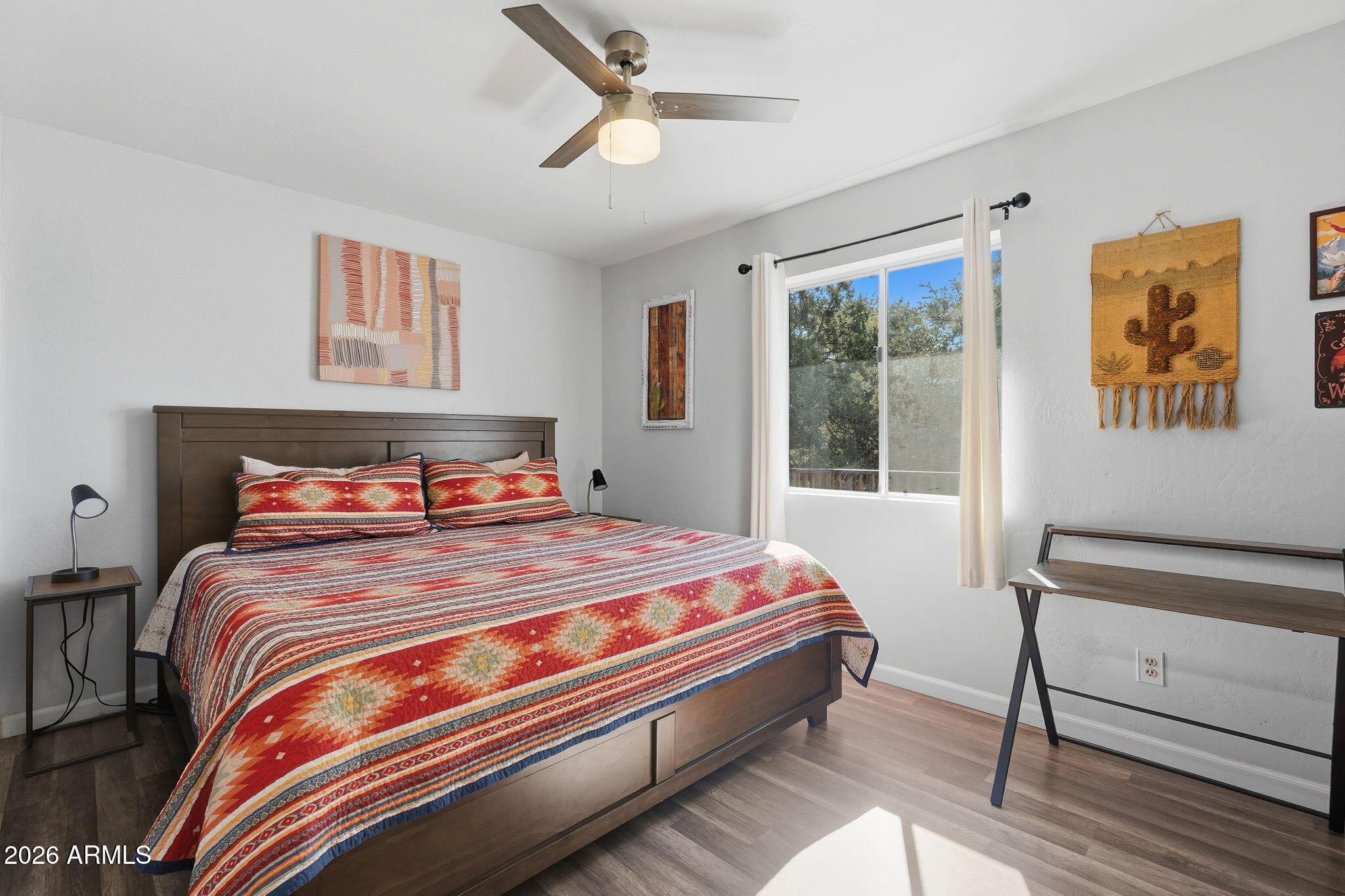 8247 Ralls Drive Pine, AZ 85544 - Photo 18 of 50 a bedroom with a bed and a window