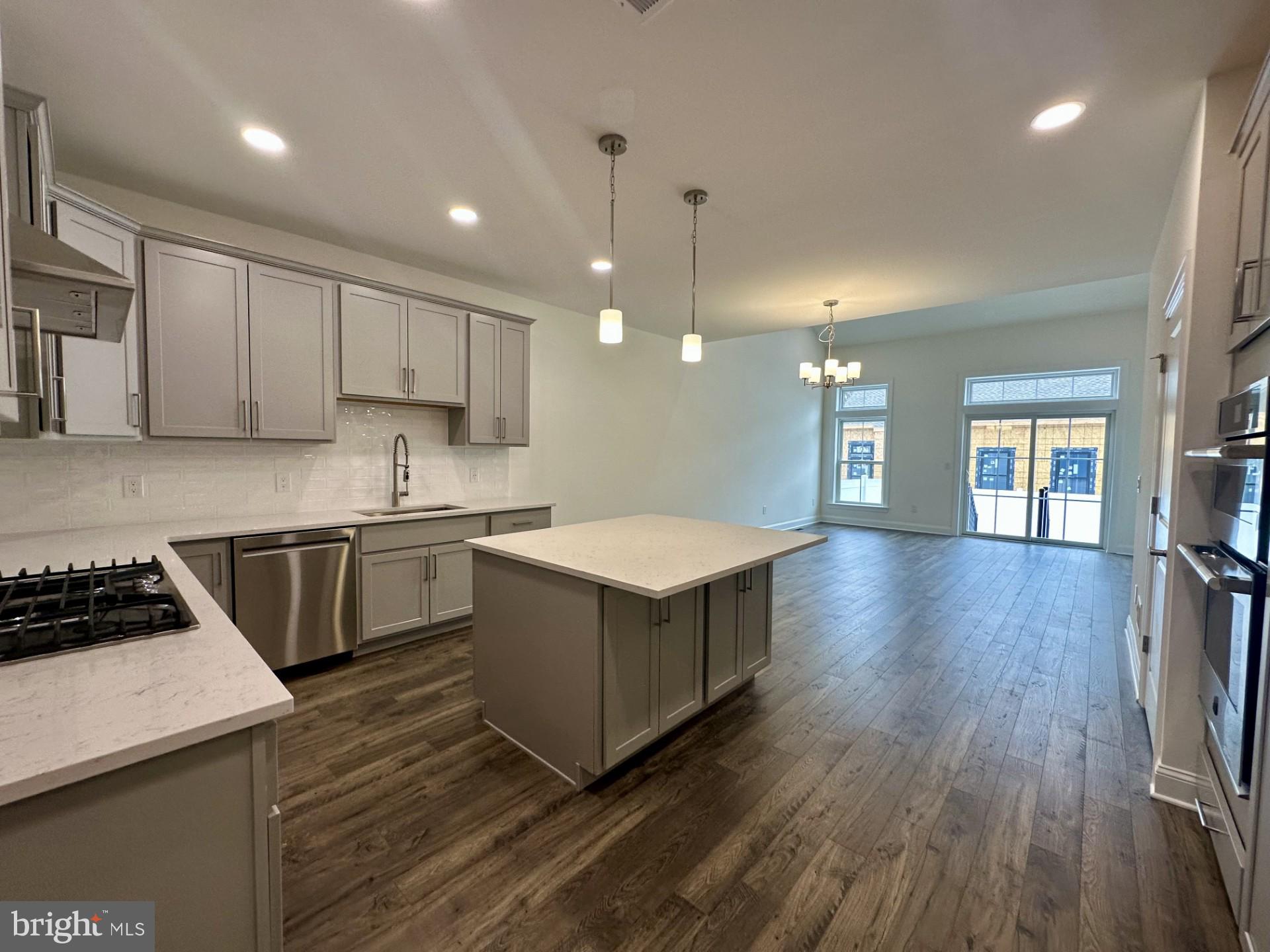 63 Kay Chiarello Way Hamilton, NJ 08690 - Photo 4 of 31 a kitchen with a cabinets and wooden floor