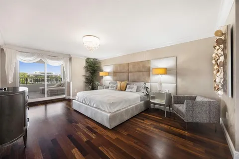 a spacious bedroom with a bed and a window