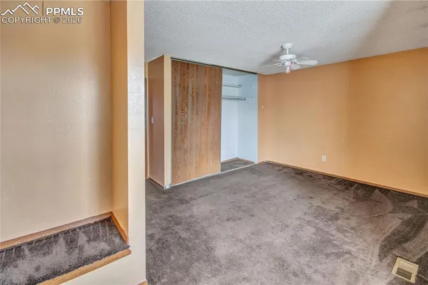 a view of hallway with wooden floor