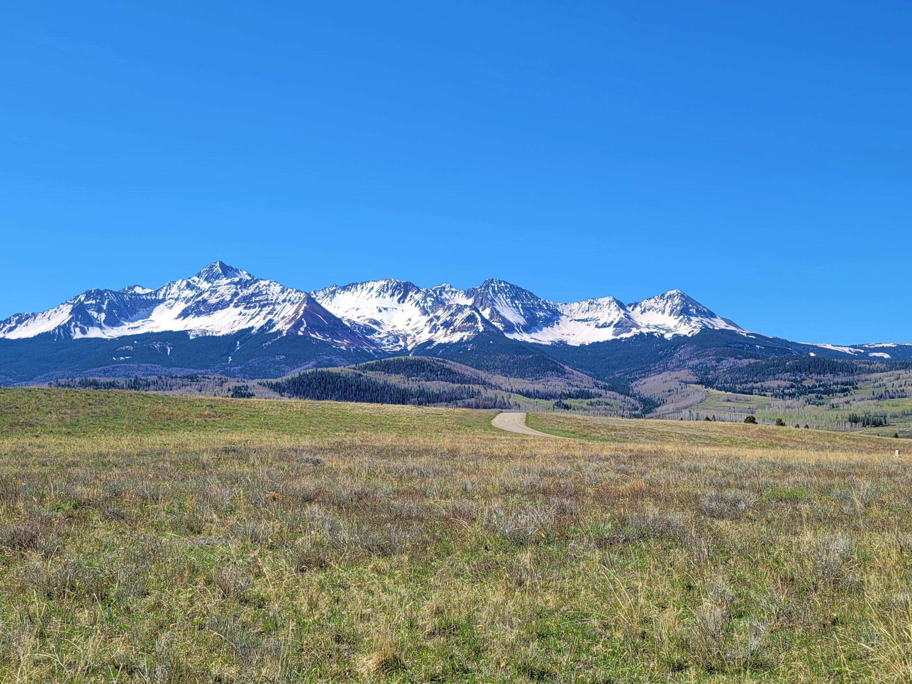 Tbd Lot 88 East Anderson Road Placerville, CO 81430 - Photo 4 of 11 a view of a room with a chandelier fan and a fireplace