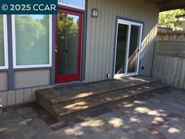 a view of balcony with wooden floor