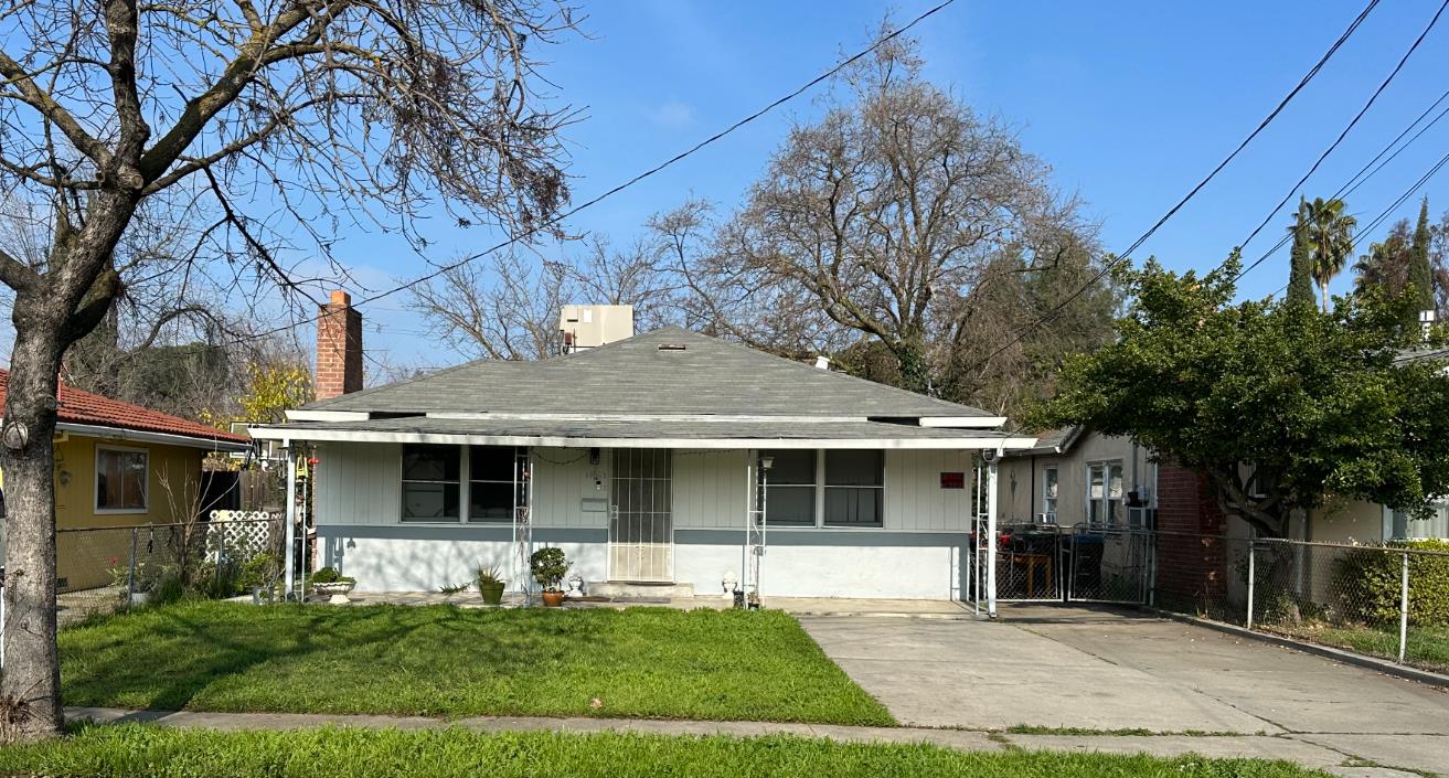 1861 West Harding Way Stockton, CA 95203 - Photo 1 of 1 a front view of a house with a yard