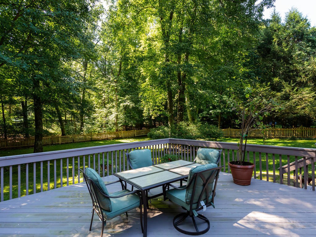 28 Ardsley Road Longmeadow, MA 01106 - Photo 6 of 30 a view of a wooden bench on the deck