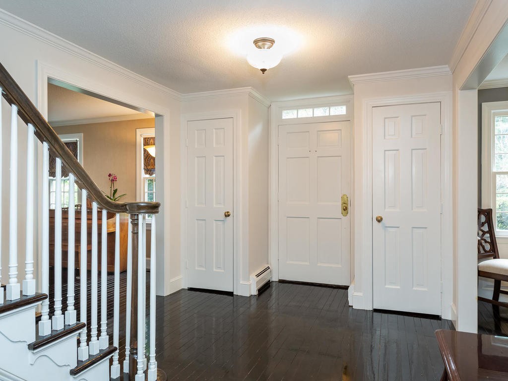28 Ardsley Road Longmeadow, MA 01106 - Photo 7 of 30 a view of a hallway with wooden floor and entryway
