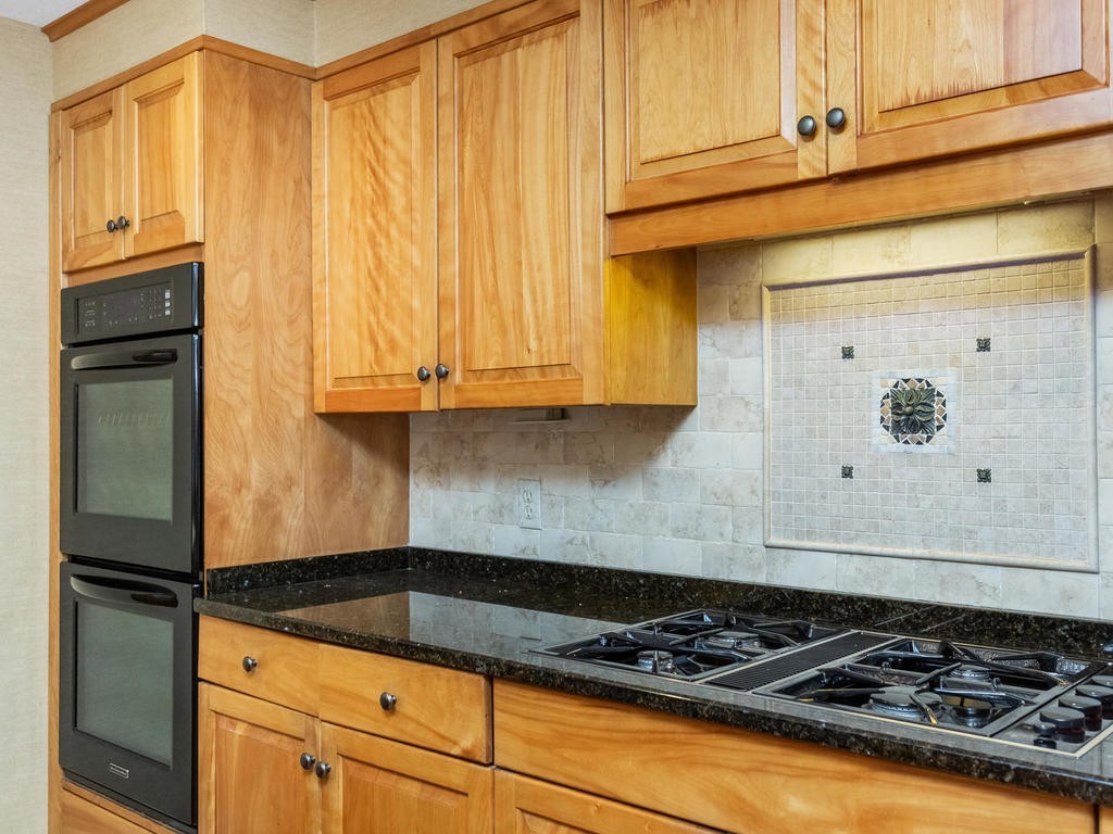 28 Ardsley Road Longmeadow, MA 01106 - Photo 10 of 30 a kitchen with granite countertop cabinets and white appliances