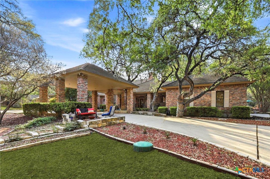 21759 Forest Waters Circle Garden Ridge, TX 78266 - Photo 1 of 30 a front view of house with yard and trees around