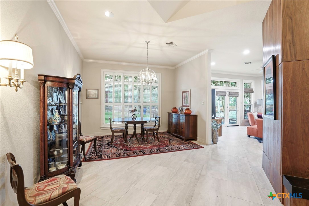 21759 Forest Waters Circle Garden Ridge, TX 78266 - Photo 13 of 30 a view of a dining room with furniture window and outside view