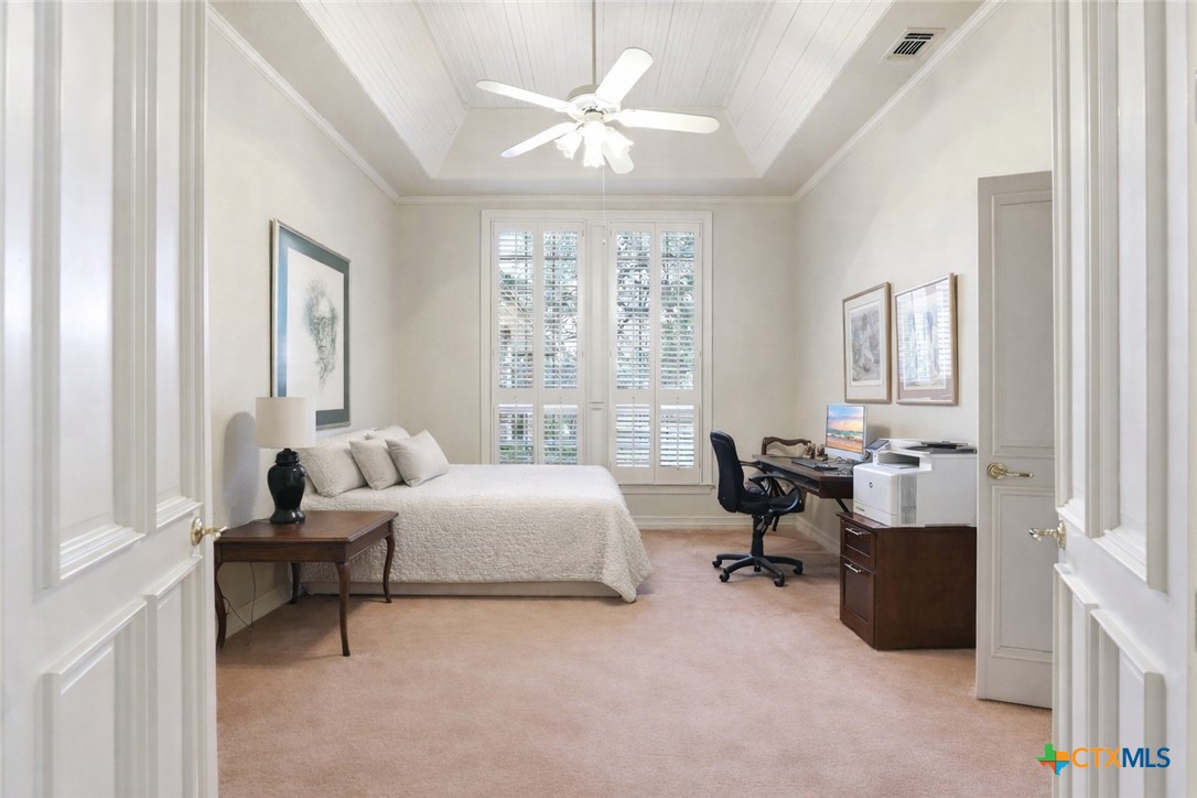 21759 Forest Waters Circle Garden Ridge, TX 78266 - Photo 14 of 30 a bedroom with furniture and a window