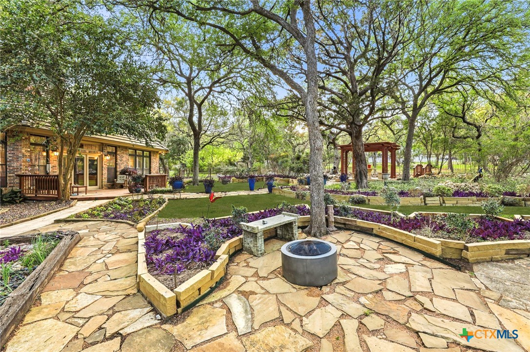 21759 Forest Waters Circle Garden Ridge, TX 78266 - Photo 22 of 30 a outdoor space with lots of trees