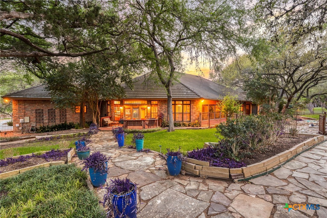 21759 Forest Waters Circle Garden Ridge, TX 78266 - Photo 26 of 30 a view of a backyard with sitting area