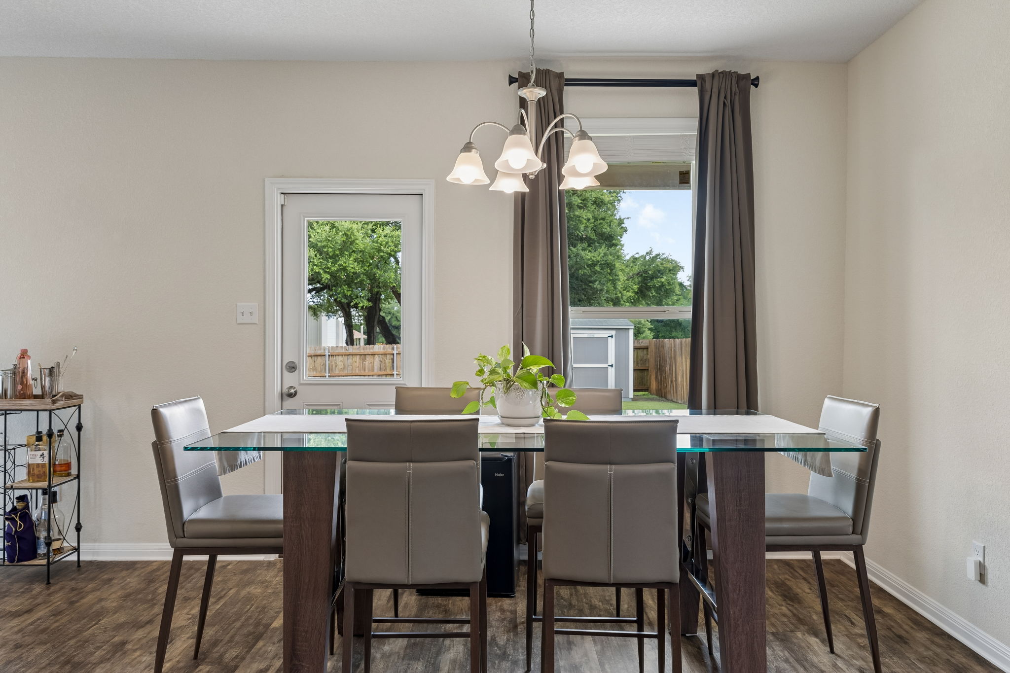 809 Whitman Avenue Georgetown, TX 78626 - Photo 13 of 35 a dining room with furniture a chandelier and a rug