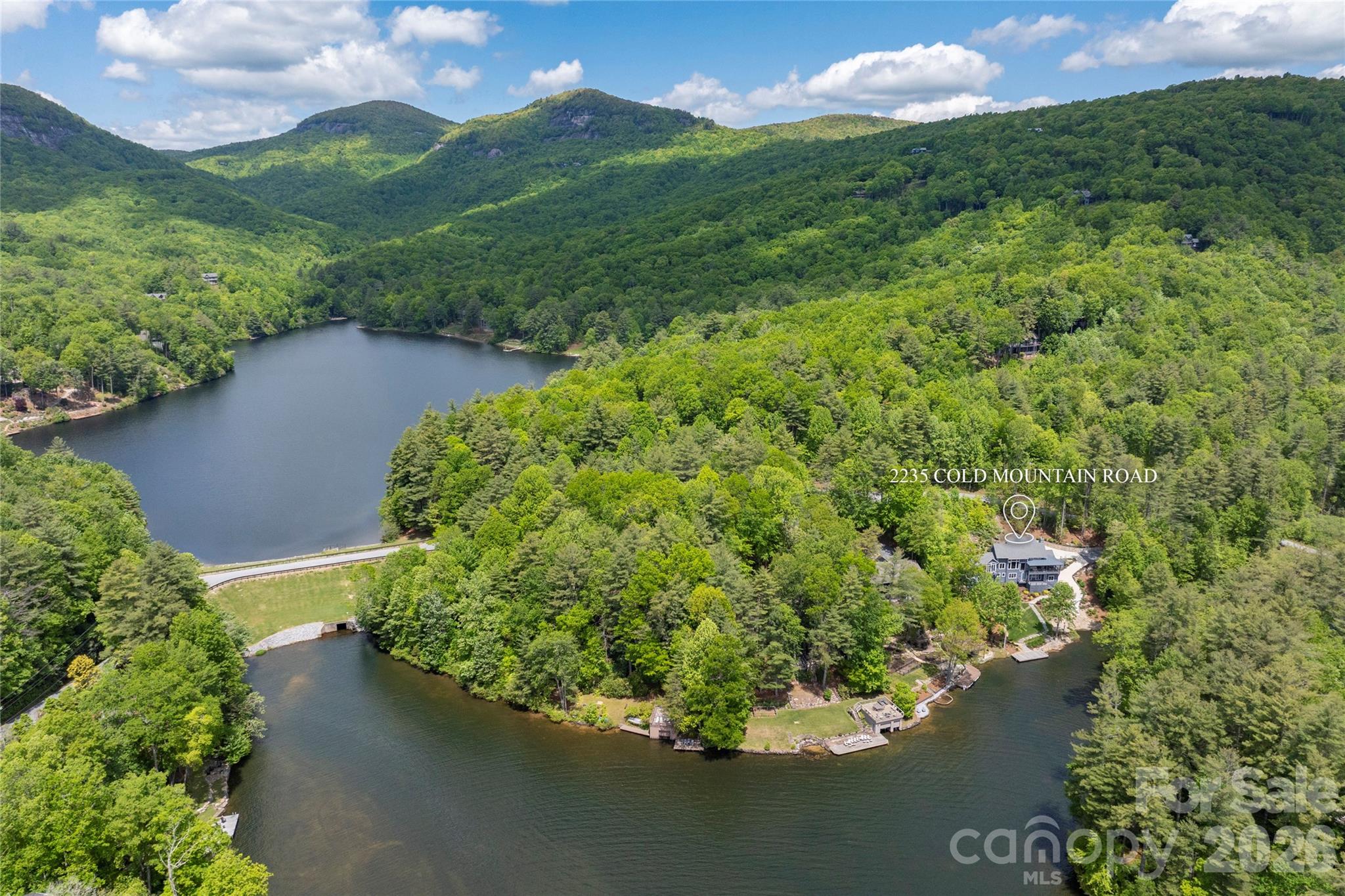 2235 Cold Mountain Road Lake Toxaway, NC 28747 - Photo 45 of 47 a view of a lake with a mountain in the background