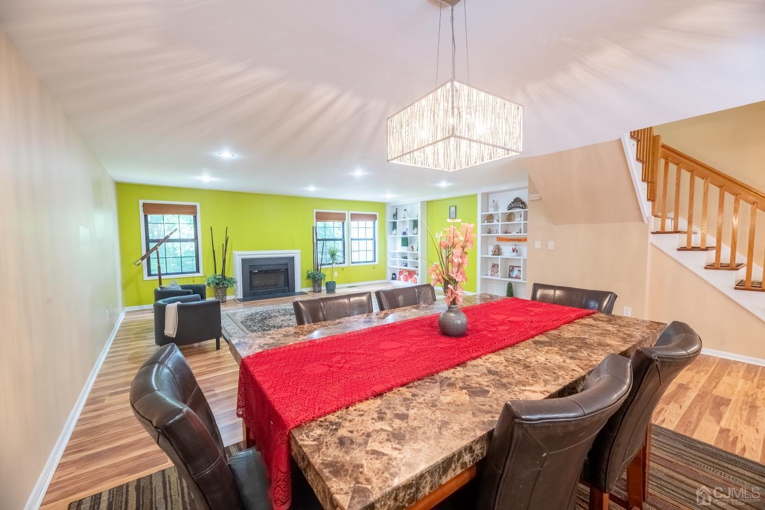 4602 Stonehedge Road Edison, NJ 08820 - Photo 32 of 87 a view of a dining room with furniture and a chandelier