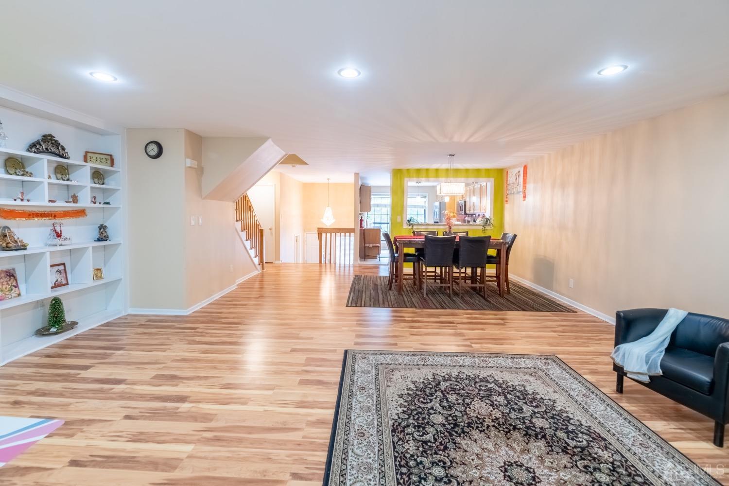 4602 Stonehedge Road Edison, NJ 08820 - Photo 36 of 87 a living room with furniture and a wooden floor