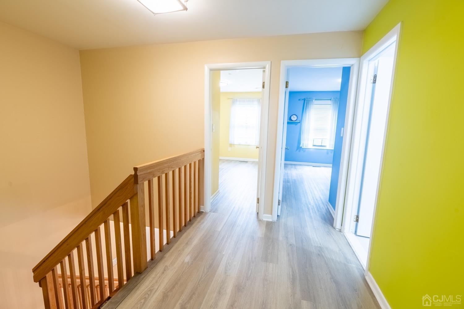 4602 Stonehedge Road Edison, NJ 08820 - Photo 47 of 87 a view of a hallway with wooden floor