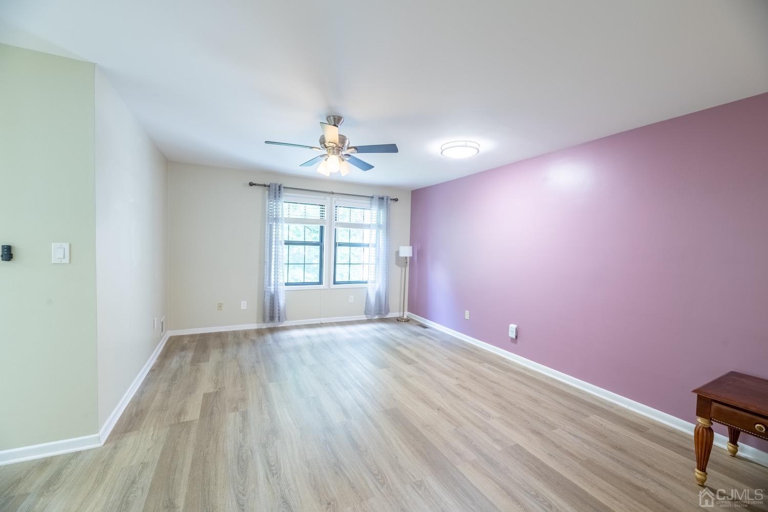 4602 Stonehedge Road Edison, NJ 08820 - Photo 49 of 87 wooden floor in an empty room with a window