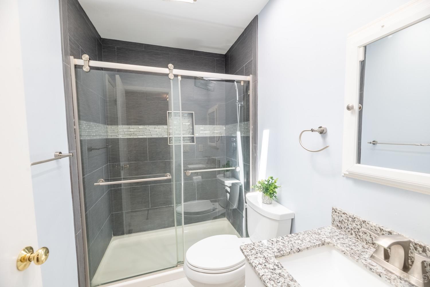 4602 Stonehedge Road Edison, NJ 08820 - Photo 70 of 87 a bath room with a toilet and a shower