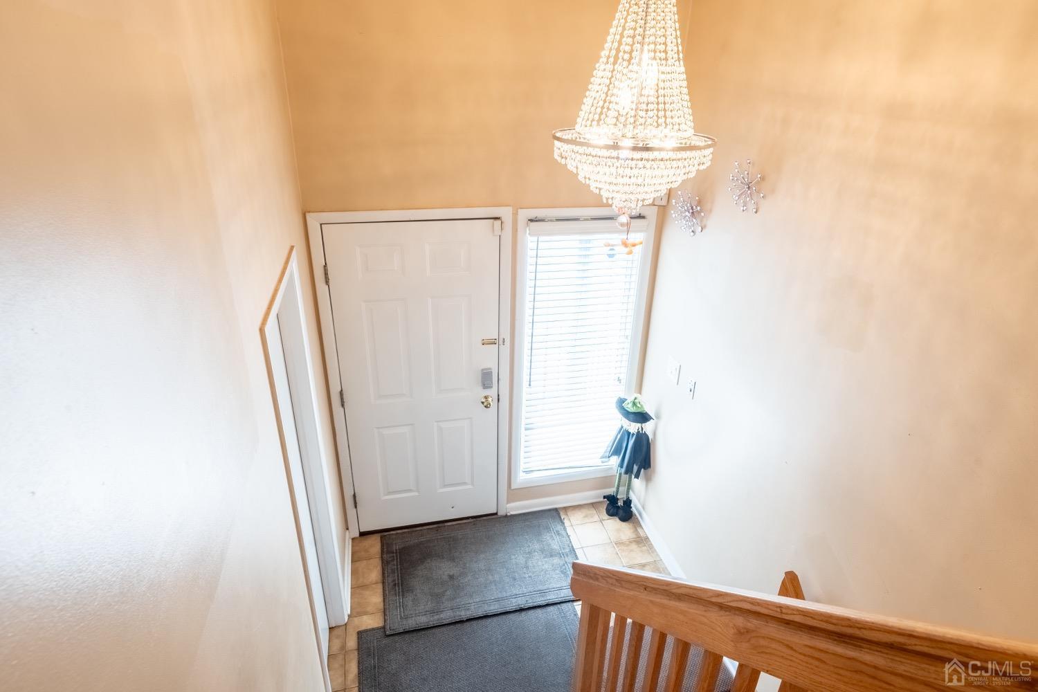 4602 Stonehedge Road Edison, NJ 08820 - Photo 7 of 87 a view of a room with wooden floor and staircase