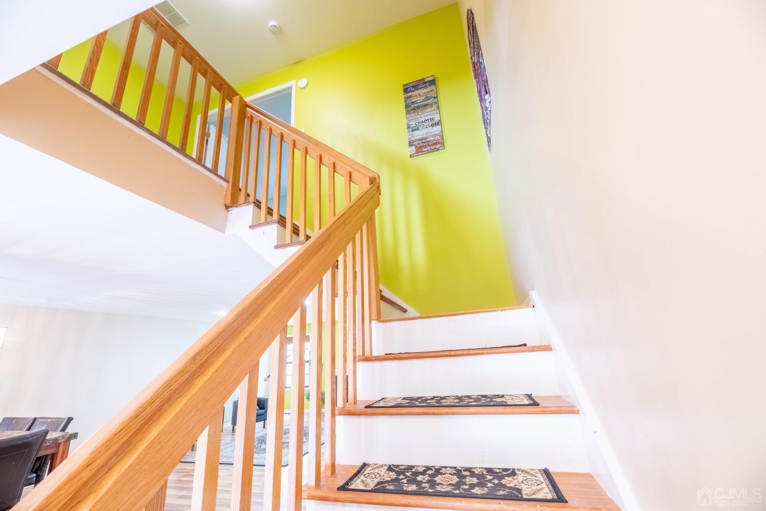 4602 Stonehedge Road Edison, NJ 08820 - Photo 75 of 87 a view of staircase with railing and a rug
