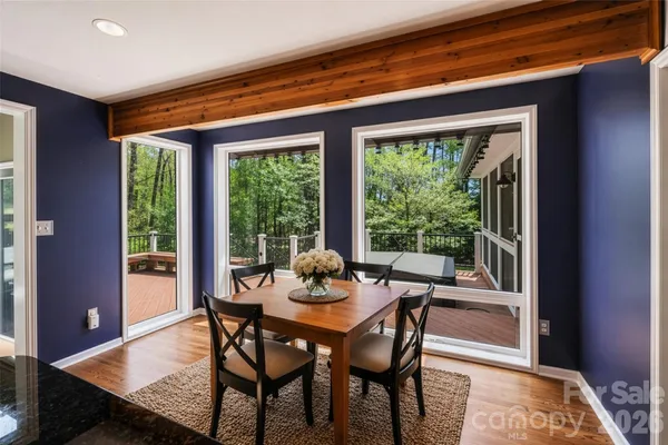 a dining room with furniture and window