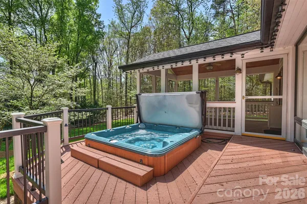 a view of a deck with wooden floor and fence