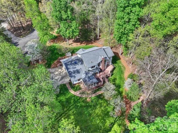 an aerial view of a house with an outdoor space