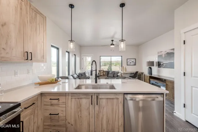 a kitchen with counter top space and sink