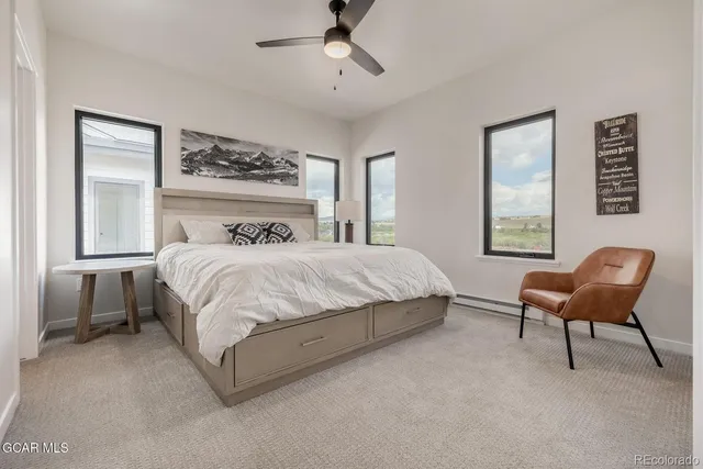 a bedroom with a bed and chair