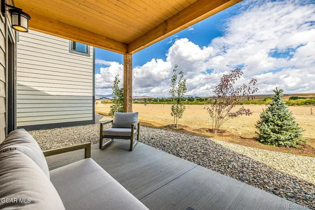 a balcony with furniture and city view