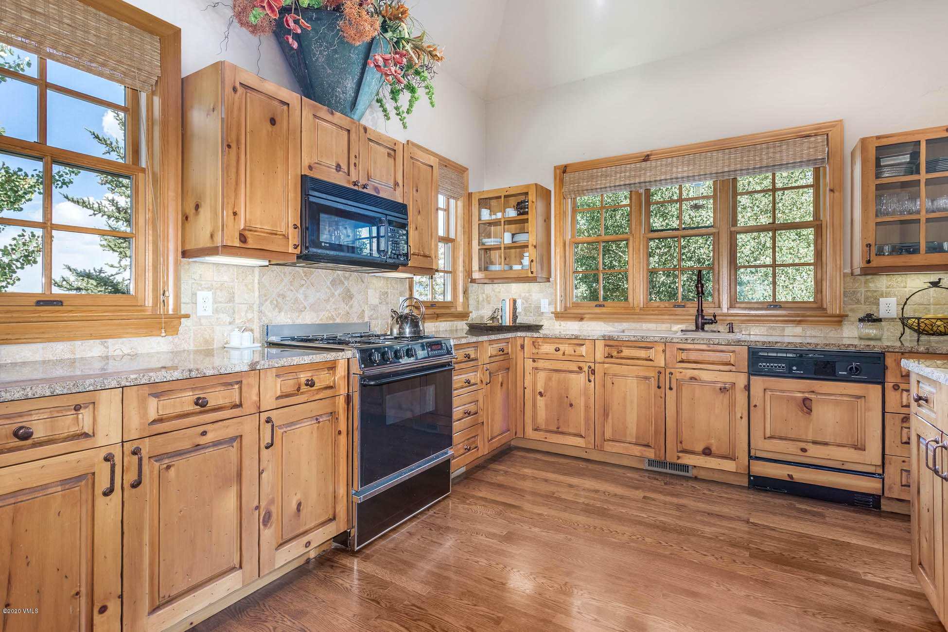36 Fairway Lane Edwards, CO 81632 - Photo 11 of 37 a large kitchen with stainless steel appliances granite countertop a stove sink and cabinets