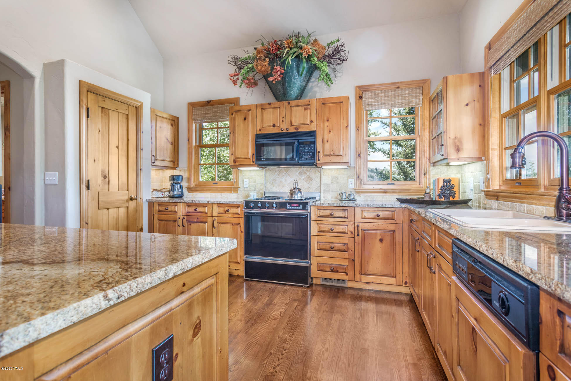 36 Fairway Lane Edwards, CO 81632 - Photo 12 of 37 a kitchen with stainless steel appliances granite countertop a stove a sink and a refrigerator