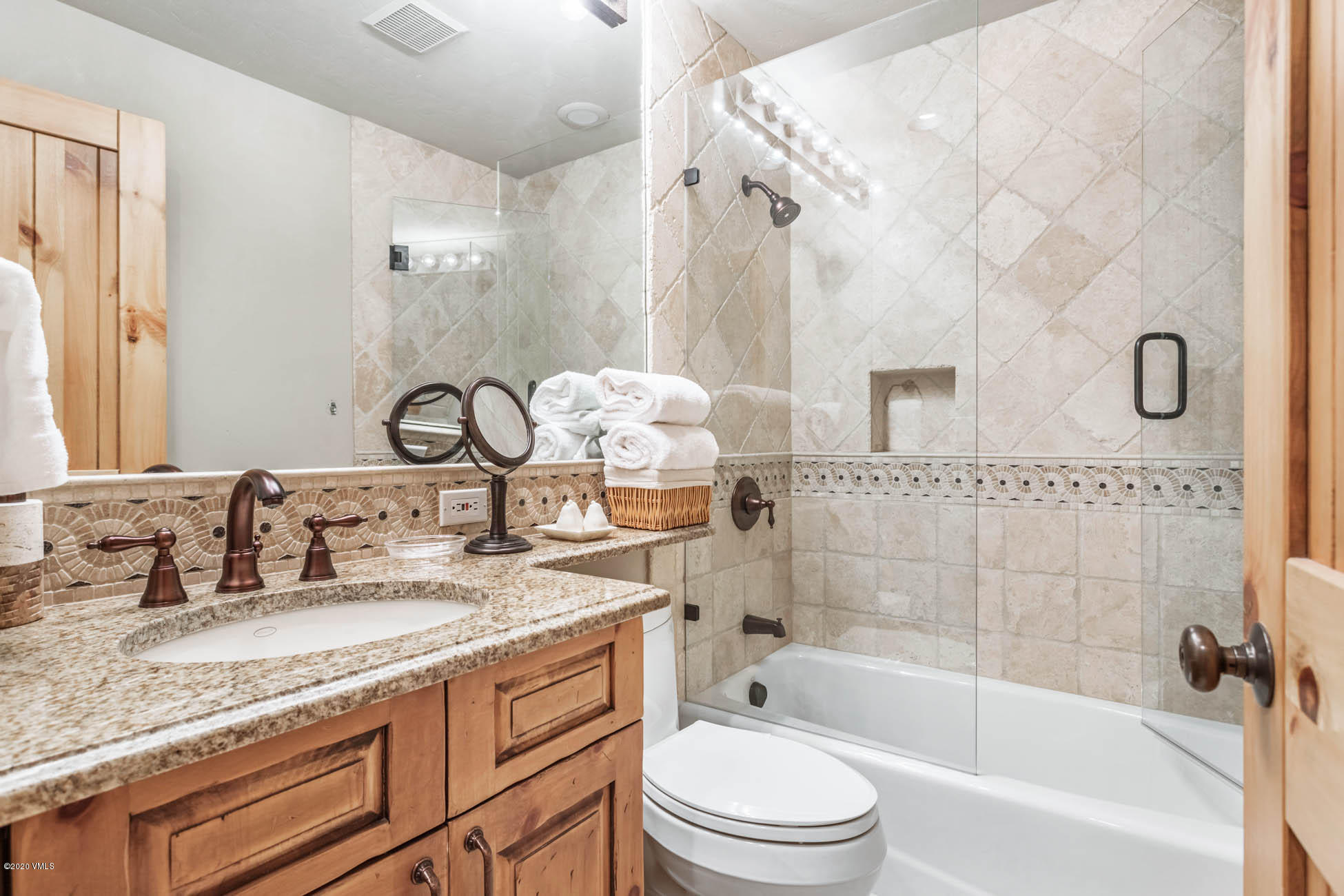 36 Fairway Lane Edwards, CO 81632 - Photo 16 of 37 a bathroom with a granite countertop sink a toilet and bathtub