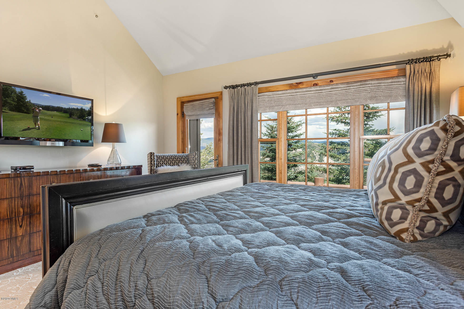 36 Fairway Lane Edwards, CO 81632 - Photo 18 of 37 a bedroom with a large bed and a flat tv screen on dresser