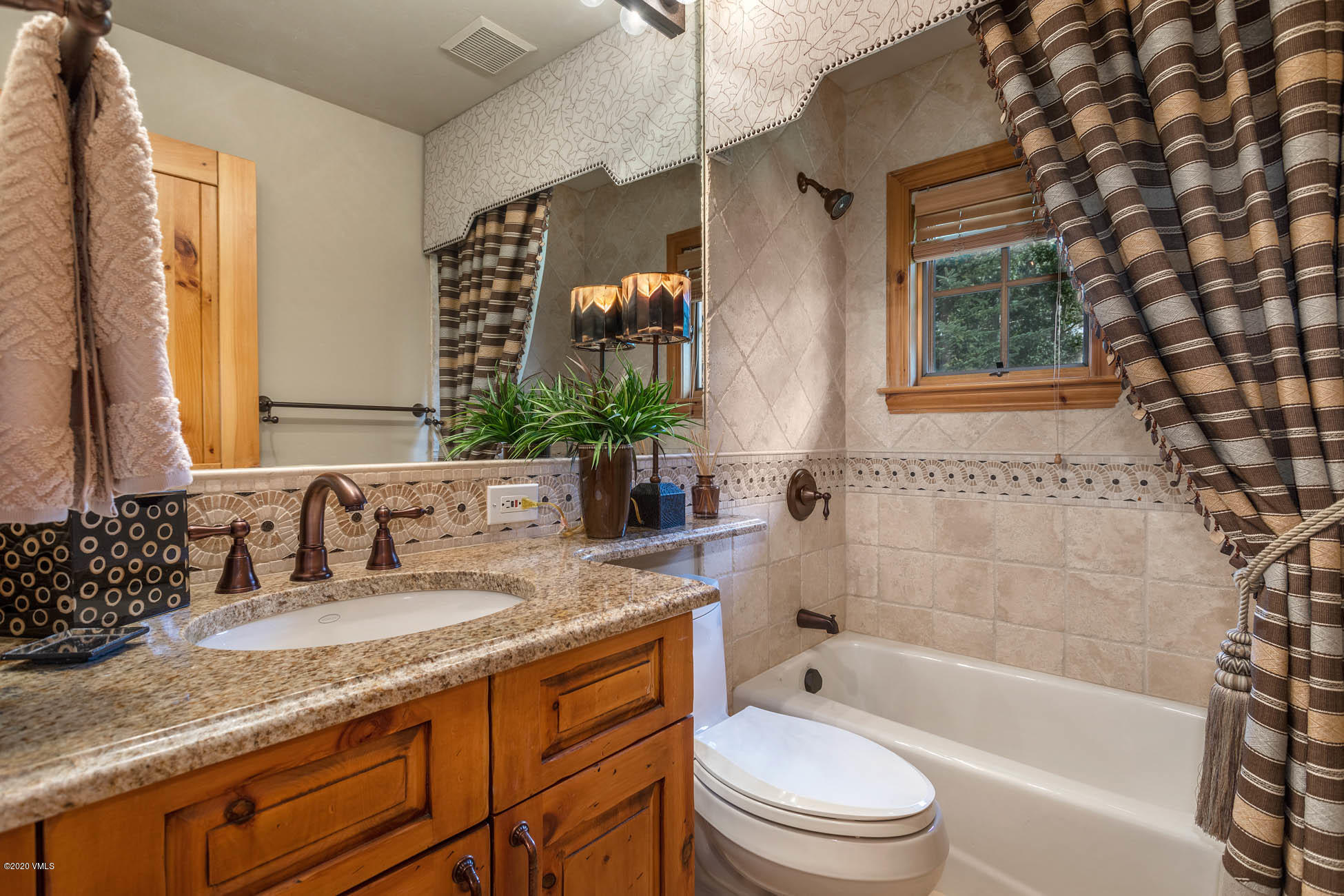 36 Fairway Lane Edwards, CO 81632 - Photo 22 of 37 a bathroom with a granite countertop sink toilet mirror and bathtub