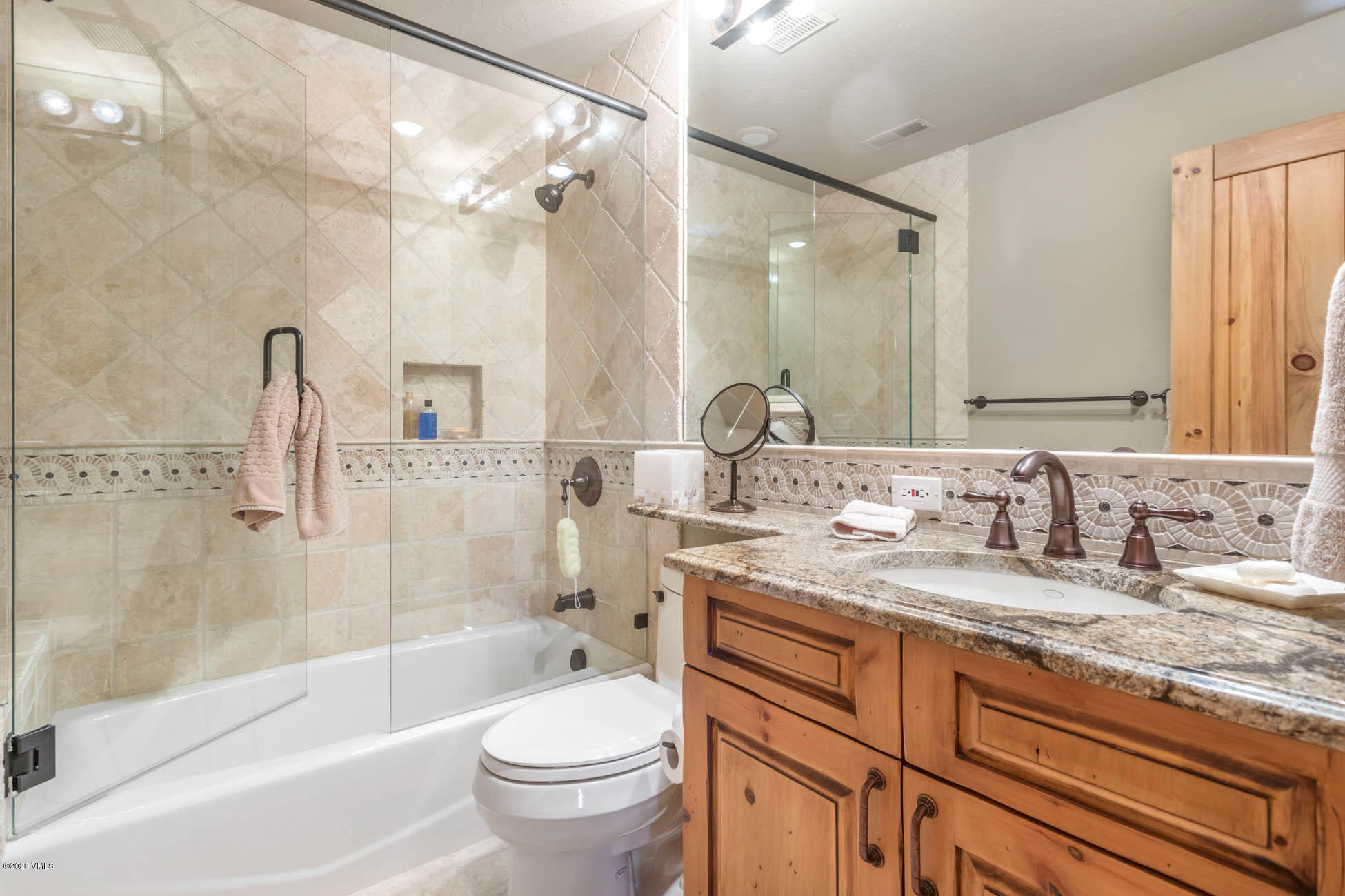 36 Fairway Lane Edwards, CO 81632 - Photo 26 of 37 a bathroom with a granite countertop sink a toilet and bathtub