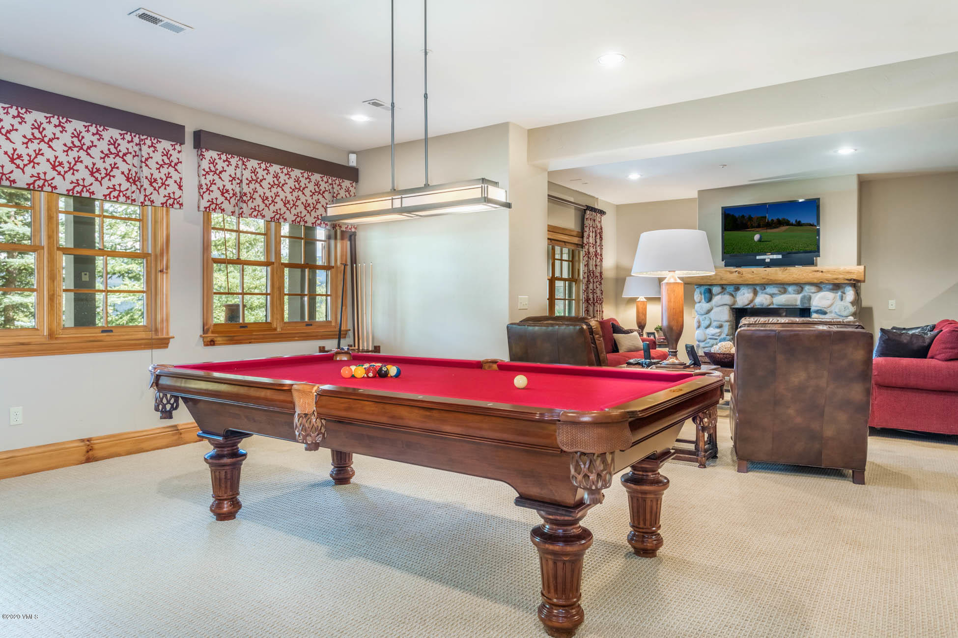 36 Fairway Lane Edwards, CO 81632 - Photo 27 of 37 a room with pool table windows and a wooden floor